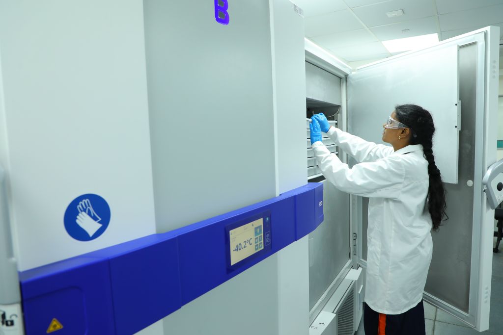 Sai Life Sciences scientist accessing a -40.2°C ultra-low temperature storage unit as part of the advanced Compound Management process, enhanced by the in-house CORAL software application.